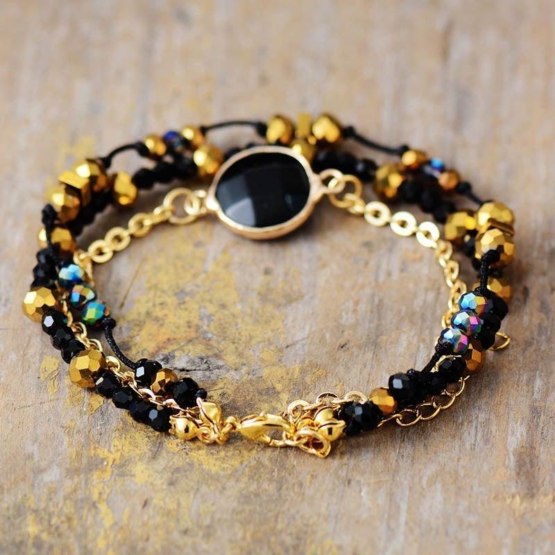 Armbånd "Positiv Aura" med forgyldte perler af sort onyx